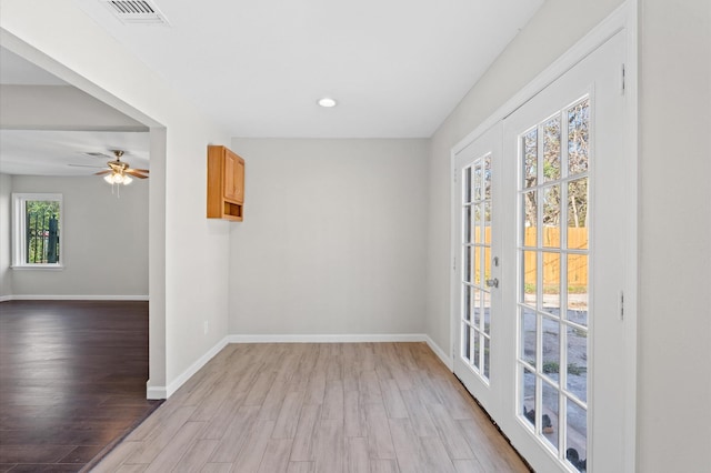 interior space featuring ceiling fan, light hardwood / wood-style flooring, and french doors