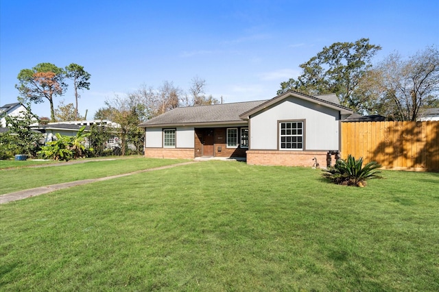 single story home with a front lawn