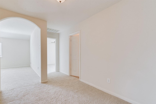 empty room with light colored carpet