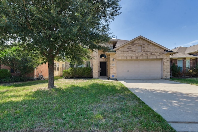 view of front of house featuring a front yard and a garage