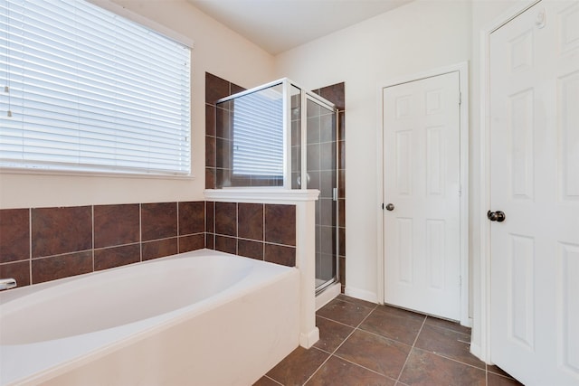 bathroom featuring tile patterned floors and shower with separate bathtub