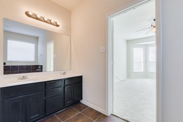 bathroom featuring ceiling fan, tile patterned flooring, and vanity