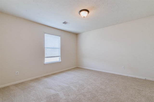 spare room featuring carpet floors