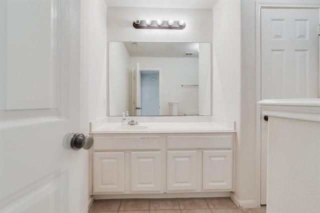 bathroom with tile patterned flooring and vanity