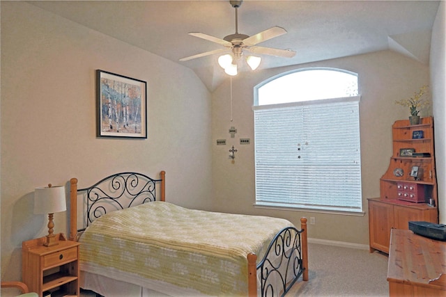 carpeted bedroom with ceiling fan and lofted ceiling