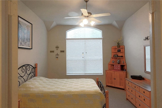 bedroom featuring carpet flooring, ceiling fan, and vaulted ceiling