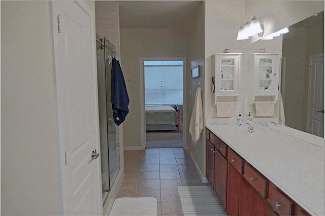 bathroom with tile patterned flooring, vanity, and an enclosed shower