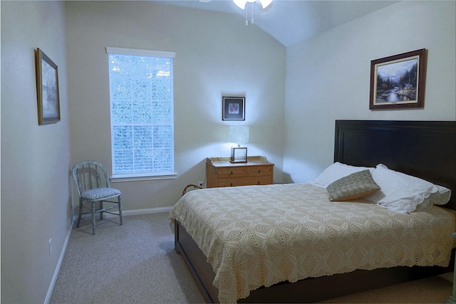 carpeted bedroom with multiple windows and lofted ceiling