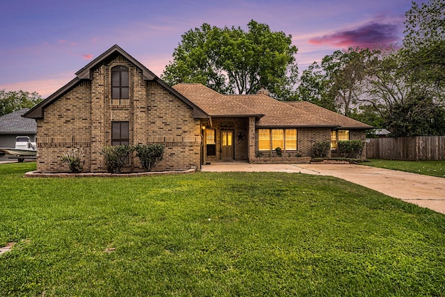 view of front of property with a lawn