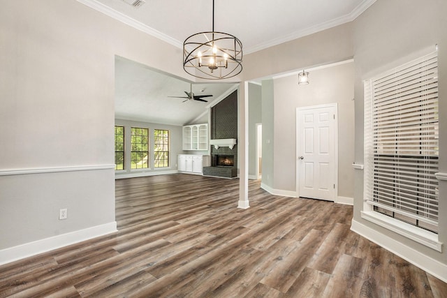 unfurnished living room with a large fireplace, ceiling fan, baseboards, and wood finished floors