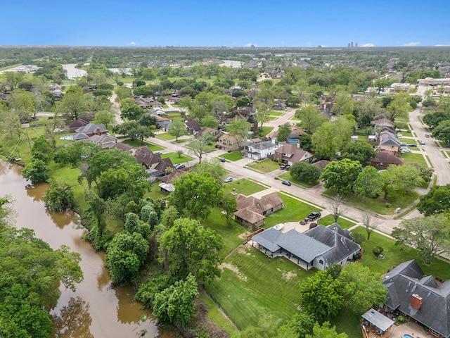 birds eye view of property featuring a water view and a residential view