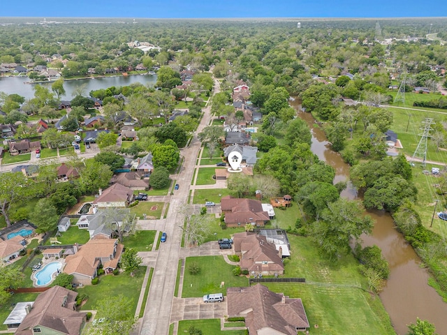 bird's eye view with a water view and a residential view