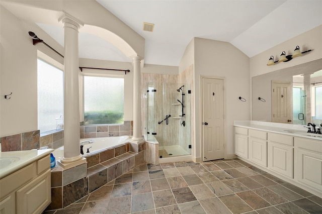 bathroom featuring vanity, ornate columns, independent shower and bath, and vaulted ceiling