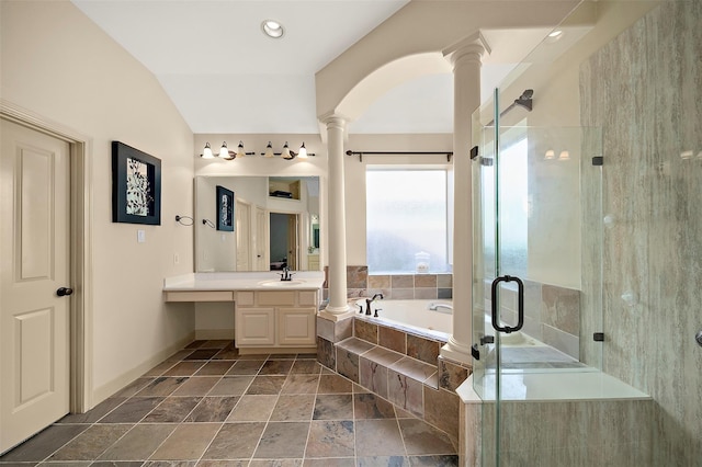 bathroom featuring vanity, independent shower and bath, and decorative columns