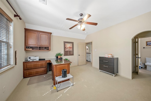 carpeted home office with ceiling fan and lofted ceiling