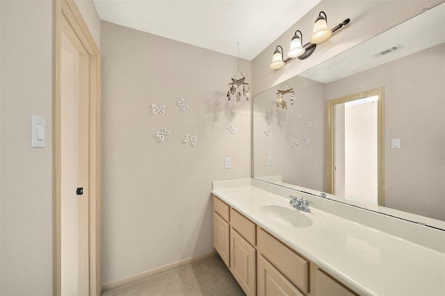 bathroom with tile patterned floors and vanity