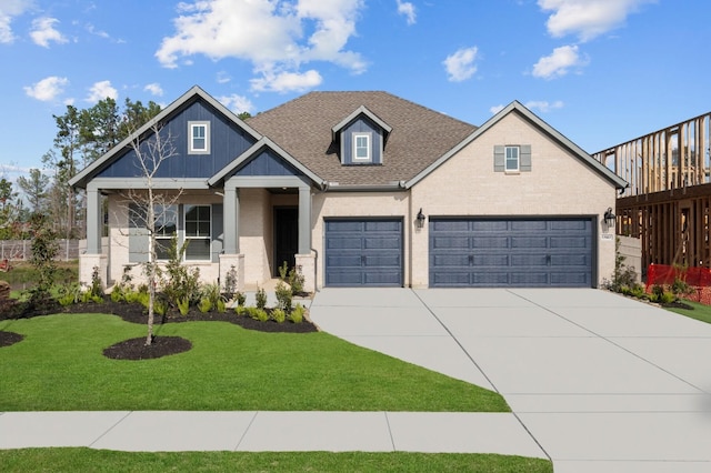 view of front of home with a garage and a front yard