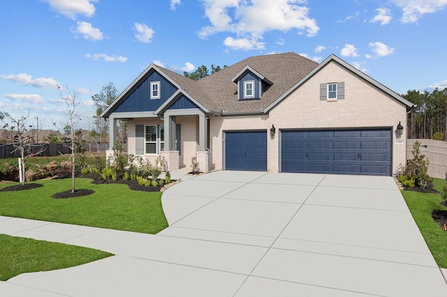 craftsman-style house with a garage and a front yard