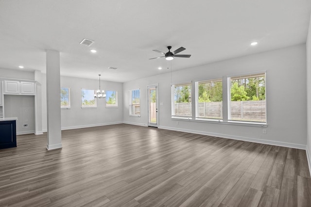17007 Sweet Iris Ct, Conroe, TX 77302 - unfurnished living room featuring healthy amount of natural light, ceiling fan, a chandelier, recessed lighting, and baseboards
