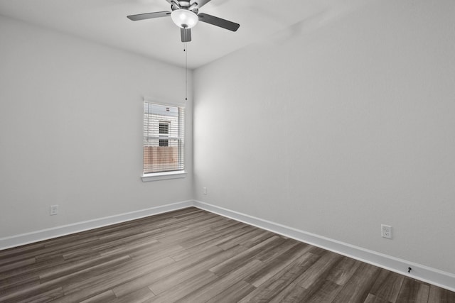 17007 Sweet Iris Ct, Conroe, TX 77302 - spare room with dark wood-style flooring, ceiling fan, and baseboards