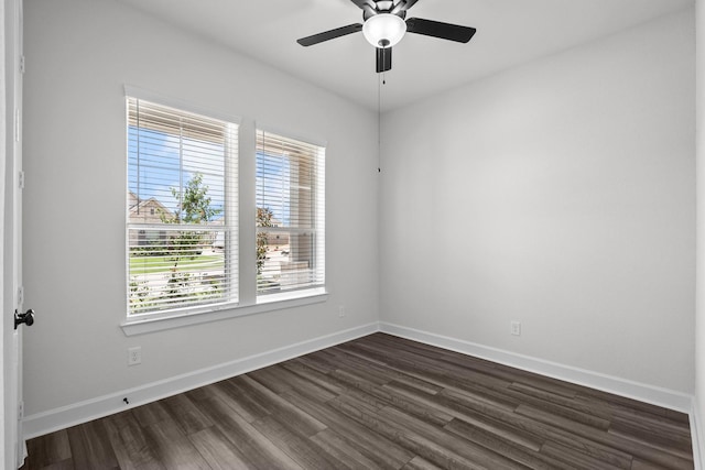 17007 Sweet Iris Ct, Conroe, TX 77302 - empty room with dark wood finished floors, ceiling fan, and baseboards