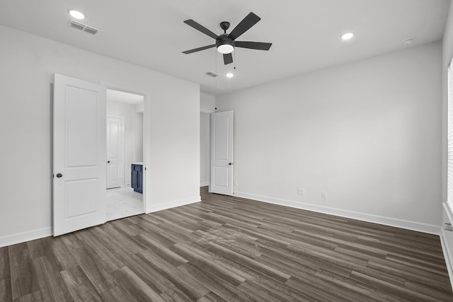 17007 Sweet Iris Ct, Conroe, TX 77302 - unfurnished bedroom with dark wood-type flooring, baseboards, recessed lighting, a ceiling fan, and ensuite bathroom