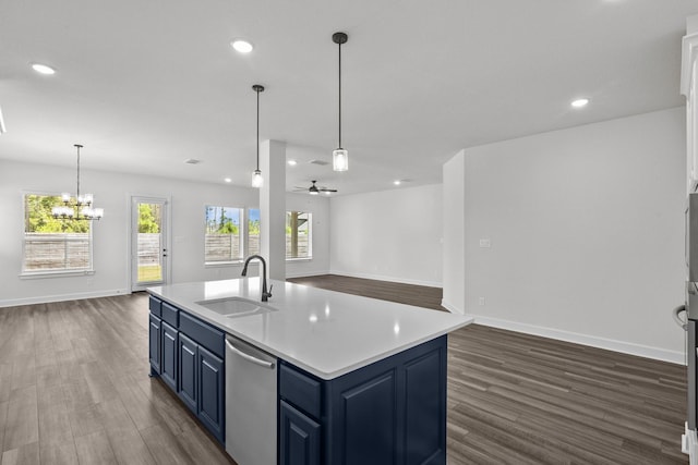17007 Sweet Iris Ct, Conroe, TX 77302 - kitchen featuring a sink, blue cabinetry, stainless steel dishwasher, dark wood finished floors, and recessed lighting