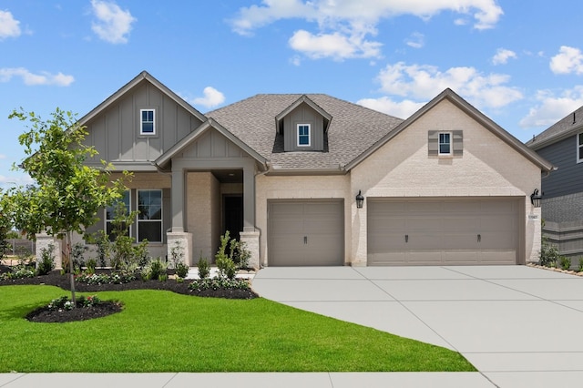 17007 Sweet Iris Ct, Conroe, TX 77302 - craftsman-style home featuring concrete driveway, board and batten siding, a front lawn, roof with shingles, and brick siding