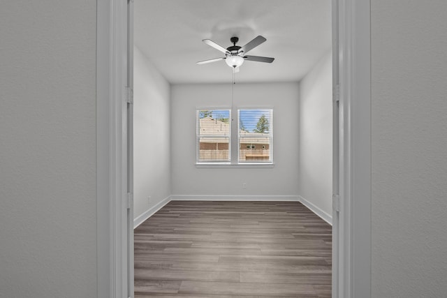 17007 Sweet Iris Ct, Conroe, TX 77302 - unfurnished room featuring dark wood finished floors, ceiling fan, and baseboards