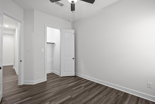 17007 Sweet Iris Ct, Conroe, TX 77302 - unfurnished bedroom featuring dark wood-style floors, baseboards, a ceiling fan, and a closet
