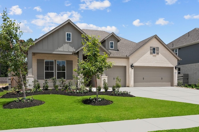 17007 Sweet Iris Ct, Conroe, TX 77302 - craftsman-style home with board and batten siding, a front lawn, driveway, a shingled roof, and an attached garage