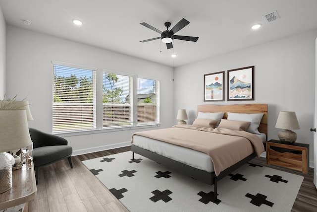 17007 Sweet Iris Ct, Conroe, TX 77302 - bedroom with wood finished floors, baseboards, recessed lighting, and ceiling fan