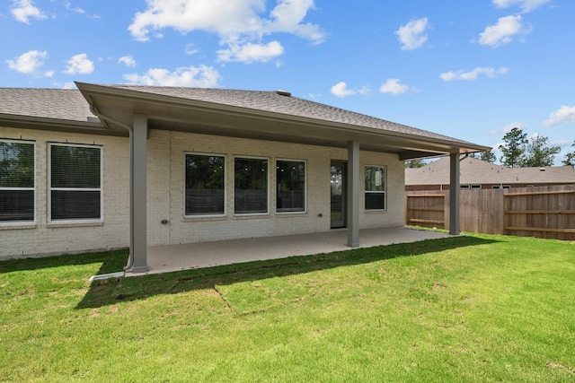17007 Sweet Iris Ct, Conroe, TX 77302 - rear view of property with a patio, brick siding, and roof with shingles