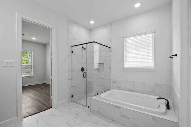 17007 Sweet Iris Ct, Conroe, TX 77302 - bathroom with a garden tub, a marble finish shower, marble finish flooring, recessed lighting, and baseboards