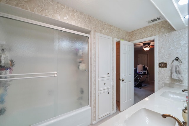 bathroom featuring shower / bath combination with glass door and vanity