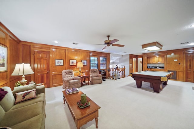 recreation room featuring ceiling fan, wood walls, billiards, and light carpet