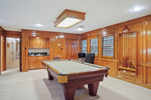 playroom featuring light colored carpet, wood walls, pool table, and bar