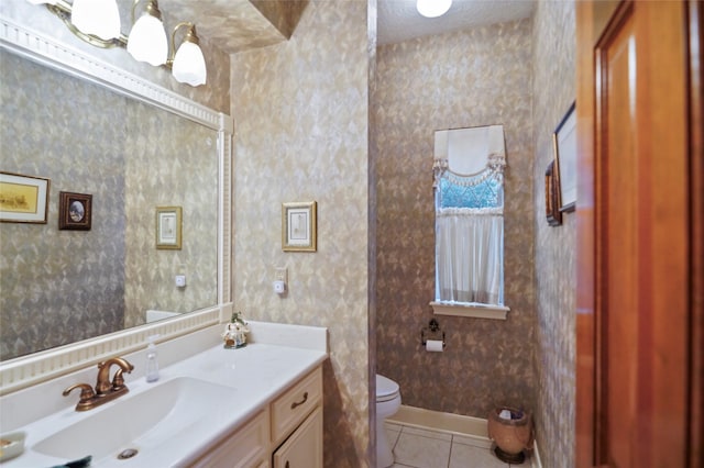 bathroom with tile patterned floors, vanity, and toilet