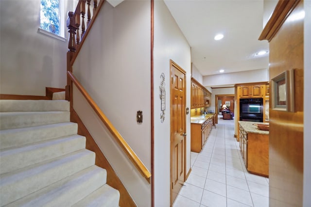 staircase featuring tile patterned floors