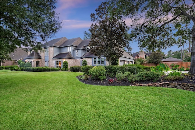 view of front of property with a lawn