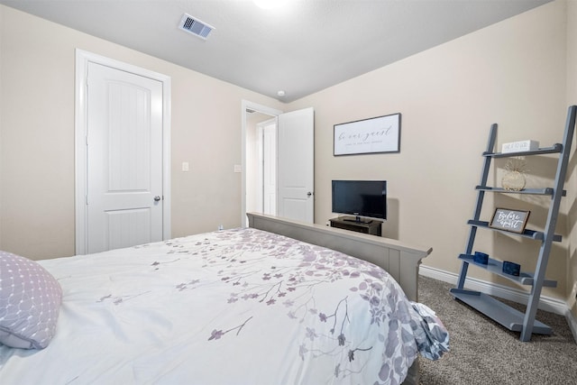 carpeted bedroom with a closet