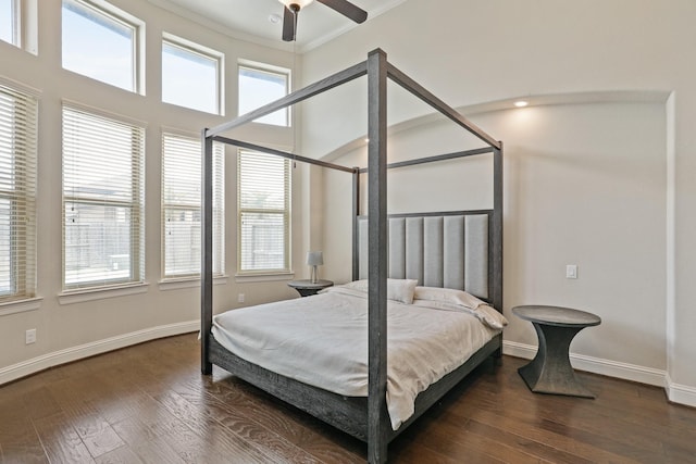 bedroom with ceiling fan, dark hardwood / wood-style flooring, and ornamental molding