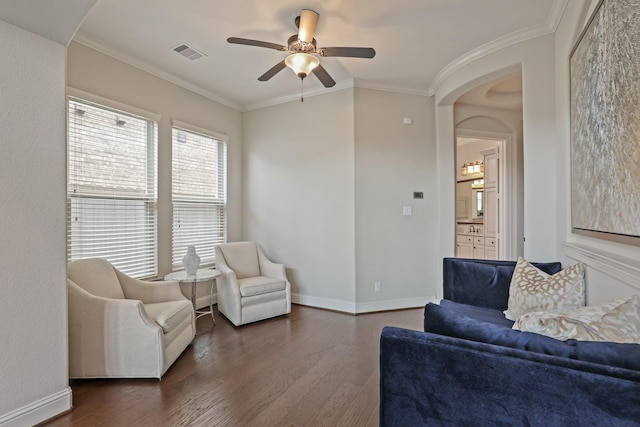 sitting room with ceiling fan, dark wood-type flooring, vaulted ceiling, and ornamental molding