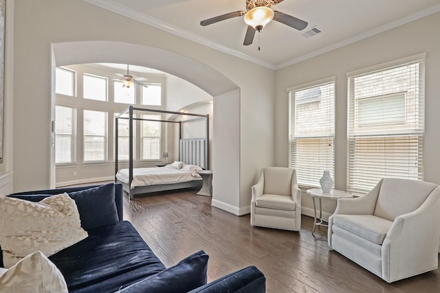 bedroom with ceiling fan, dark hardwood / wood-style flooring, and crown molding