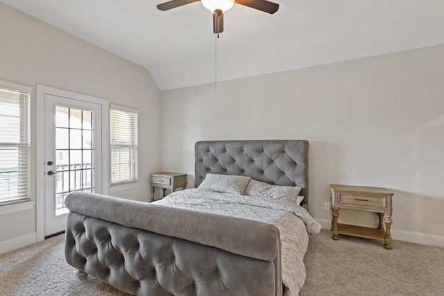 bedroom with access to outside, multiple windows, ceiling fan, and vaulted ceiling