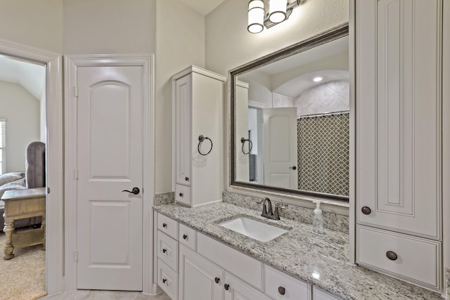 bathroom with vanity and walk in shower