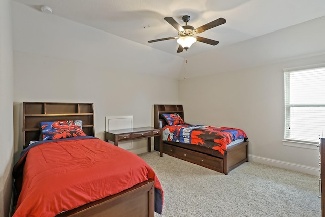 bedroom featuring ceiling fan, light colored carpet, and vaulted ceiling