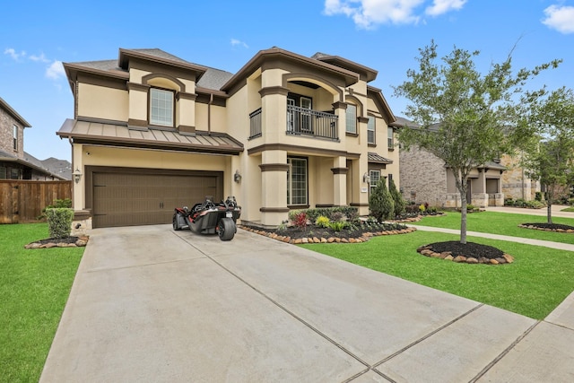 mediterranean / spanish-style home with a garage, a balcony, and a front yard