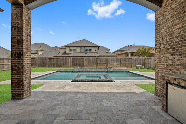 view of pool featuring an in ground hot tub and a patio