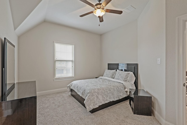 carpeted bedroom with ceiling fan and vaulted ceiling